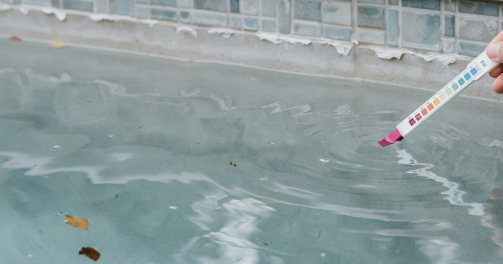Cloudy pool water with white scaling caused by high alkalinity