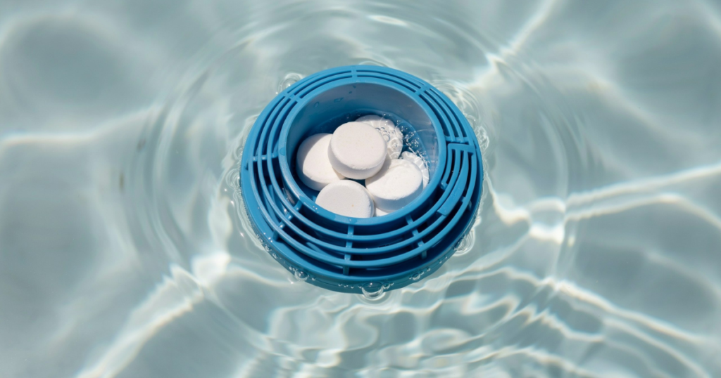chlorine tablets in a pool floater dispenser — slow release maintenance method, not for emergency chlorine raises