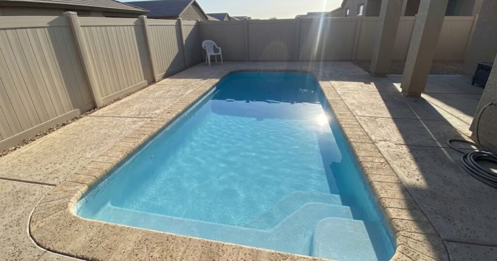 Clear blue residential pool water with no foam after correct water chemistry treatment in Arizona backyard