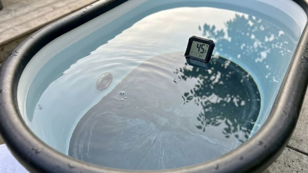 Cold Plunge Water Chemistry Clear cold plunge water with thermometer showing ideal cold water temperature