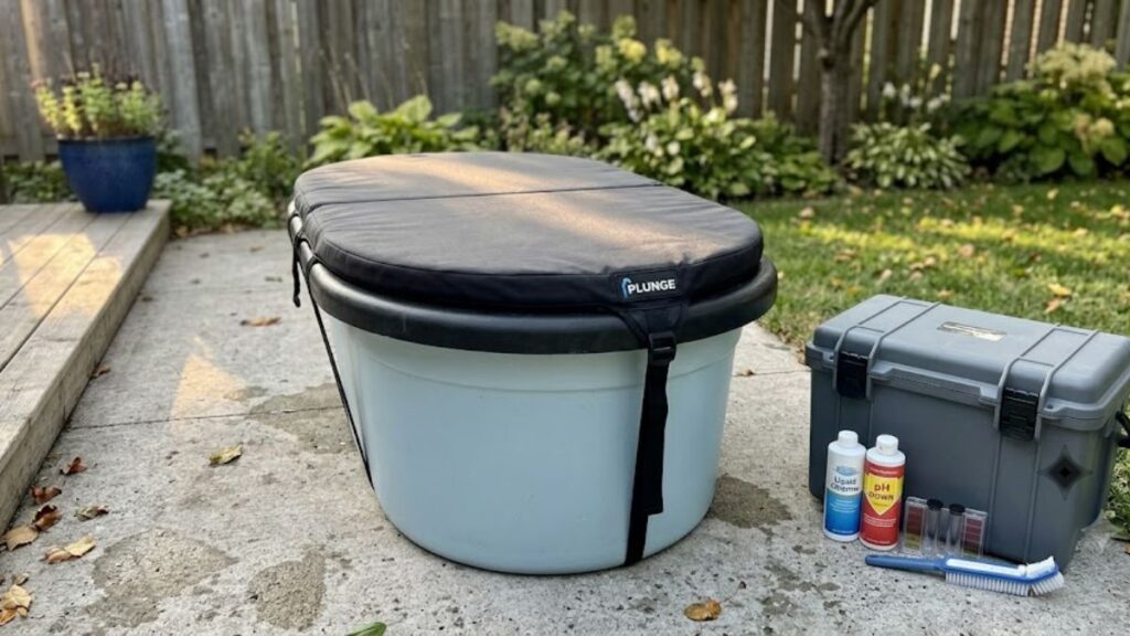 Covered cold plunge after water chemistry maintenance in a residential backyard